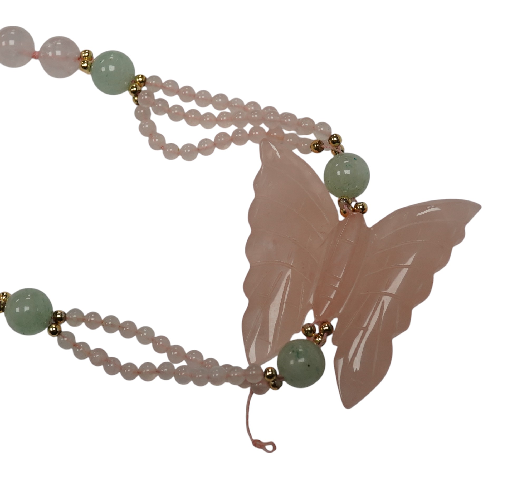 A recent rose quartz bead necklace, with central rose quartz butterfly and yellow metal and green quartz bead spacers, approx. 90cm. Condition - fair to good